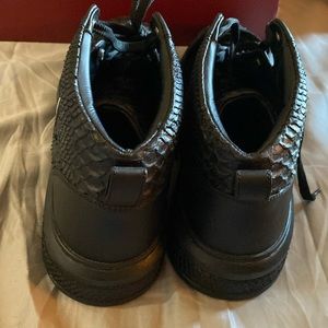 Bally’s. Black, with black and white Bally stripe. Size 13.